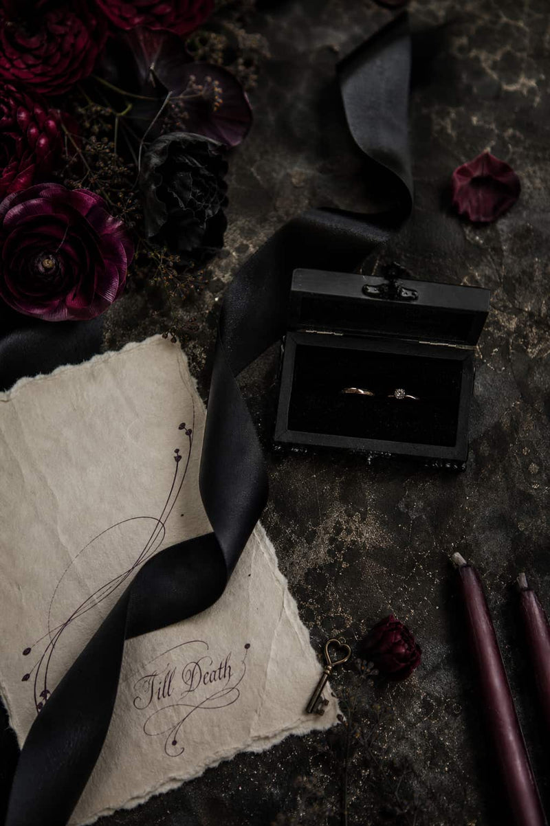 Gothic ring box with two gold wedding rings dark romantic