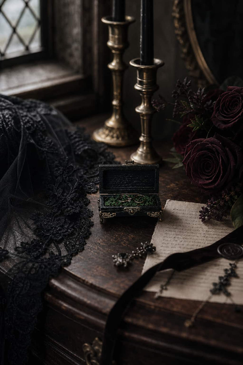 Gothic wooden ring box with moss lining and gold rings