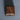 Closed walnut wedding ring box showing natural wood grain and metal details