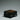 Curled antique bronze feet on a dark Celtic wedding ring box