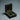 Open dark Celtic ring box with black wedding rings on preserved eucalyptus leaves